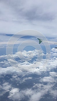 Abstract cloud sky background with a view from above the plane