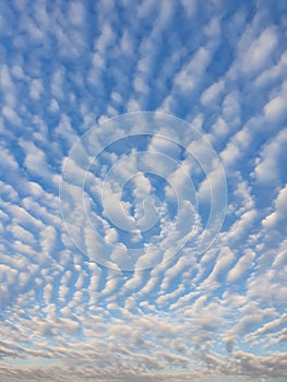 Abstract cloudscape scene. Beautiful sky background with fluffy clouds texture. Marvelous aerial composition, overcast shapes and