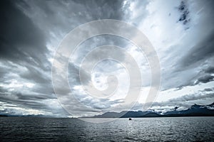 Abstract cloudy waterscape AND MOUNTAIN RANGE IN ALASKA