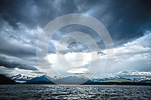 Abstract cloudy waterscape AND MOUNTAIN RANGE IN ALASKA