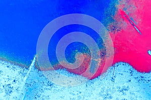 Abstract color background. The metal plate is painted red and blue.