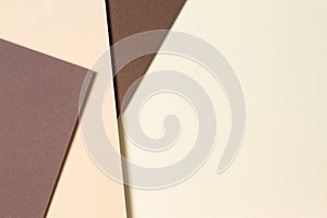 Abstract color papers geometry composition background with beige and brown tones