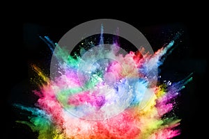 Abstract colored dust explosion on a black background.