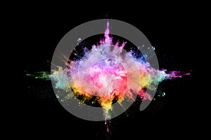 Abstract colored dust explosion on a black background.