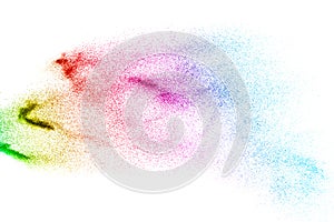 Abstract colored sand splash on white background. Color dust explode on background photo