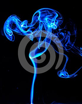 Abstract colored smoke isolated in black background