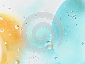 abstract colorful backdrop with oil drops on water surface. possible themes for the application - cosmetic advertising, space, fan