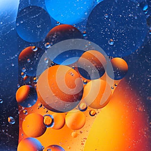 abstract colorful backdrop with oil drops on water surface. possible themes for the application - cosmetic advertising, space, fan