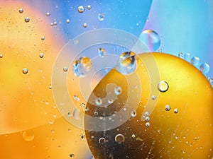 abstract colorful backdrop with oil drops on water surface. possible themes for the application - cosmetic advertising, space, fan