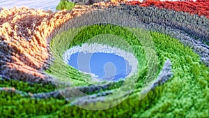 Abstract colorful background. Digital nature art. Abstract 3d topographic nature landscape with green grass and blue lake. 3D