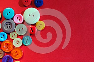 Abstract colorful background. Multi-colored buttons over red background.