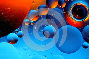 Abstract colorful background of oil circles. Oil in the water surface circles, water foam and oil bubbles.