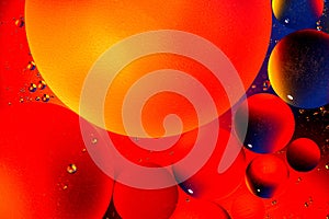 Abstract colorful background of oil circles. Oil in the water surface circles, water foam and oil bubbles.