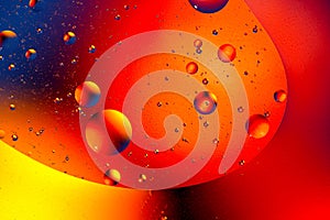 Abstract colorful background of oil circles. Oil in the water surface circles, water foam and oil bubbles.