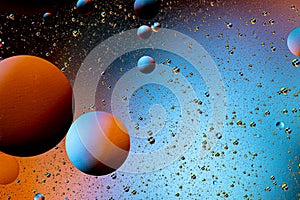 Abstract colorful background of oil circles. Oil in the water surface circles, water foam and oil bubbles.