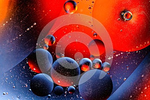 Abstract colorful background of oil circles. Oil in the water surface circles, water foam and oil bubbles.