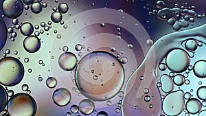 Abstract Colorful Food Oil Drops Bubbles and spheres Flowing on Water Surface, macro Videography