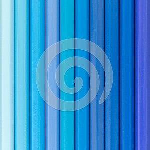 Blue colored pencils background top view