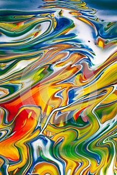 Abstract colorful image of spilled oil paint Vertcial