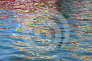 Colorful reflection of a boat in the water