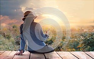 Abstract colorful, woman relaxing with smartphone in hand on outdoors in sunset rural nature