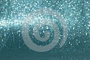 Sparkly glitter, blue background bokeh effect photo