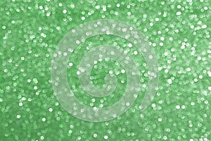 Sparkly glitter, green background bokeh effect