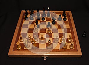 Abstract composition of chess figures. Isolated on black background,children`s mat