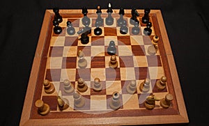 Abstract composition of chess figures. Isolated on black background,children`s mat