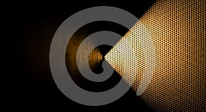 Abstract Golden Perforated Surface Illuminated by a Dramatic Spotlight background texture