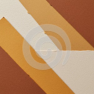 Abstract composition featuring overlapping paper strips in shades of brown, tan, and