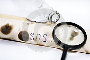 Abstract composition of SOS bottle.