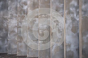 Abstract concrete wall with vertical columns as background. Cement wall with concrete pillars.