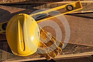 Abstract of Construction Hard Hat, Gloves, Level and House Plans