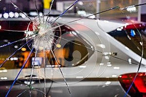 Abstract Cracked Window Glass background. Crash windshield glass of car. The broken and damaged window glass of a car background