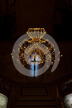 Abstract cross in church on black cement background