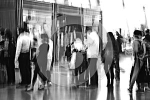 Traveler silhouettes in motion blur, airport interior