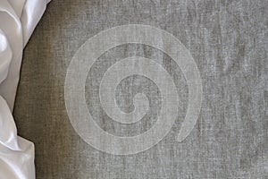 Abstract crumpled linen fabric texture background. Natural gray hue dyed linen and white color blend linen fabric