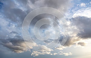 Abstract dark clouds on blue sky as background. Copy space