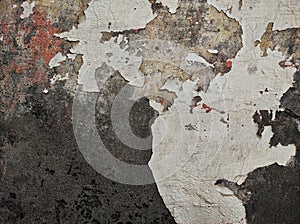 Abstract Dark Grunge wall texture background. Paint cracking off dark wall with rust underneath.distressed crackled texture.