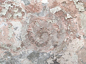 Abstract Dark Grunge wall texture background. Paint cracking off dark wall with rust underneath.distressed crackled texture.