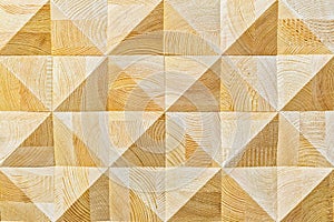 Abstract decorative ecological unpainted light wooden background with geomethrical mosaik wood pattern close-up, natural