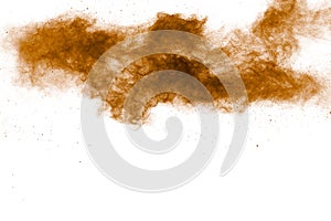 Abstract deep brown dust explosion on white background.Freeze motion of brown dust splash