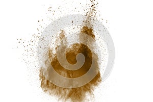 Abstract deep brown dust explosion on white background.  Freeze motion of coffee liked color dust splash photo