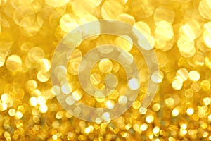 Abstract defocus bokeh lights on golden background.