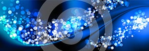 Abstract defocused circular multicolored luxury blue glitter bokeh lights background. Magic background.Holiday background.