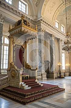 Abstract design of empty throne in palace hall