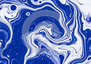 Abstract design featuring swirling patterns of blue and white, resembling marbled textures. The