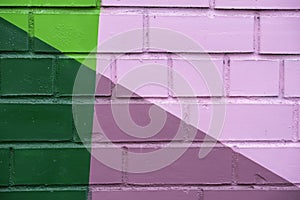 Abstract detail of brick wall with fragment of colorful paint like as graffiti. With place for your text, for background