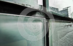 Abstract detail of dirty glass panes on side of the building